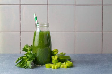 A glass of green celery juice. Celery drink prepared for healthy nutrition and detox.