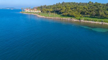 Aerial drone view of Urla district of Izmir, Turkey's third largest city. Iskele - Karantina island - Turkey clipart