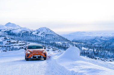 Rauland, Norway - January 14, 2023: Orange electric car MG4 is a hatchback chinese electric car