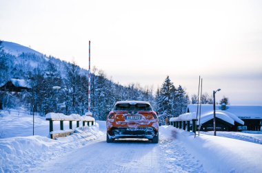 Rauland, Norway - January 14, 2023: Orange electric car MG4 is a hatchback chinese electric car