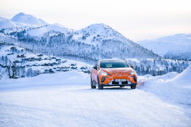 Rauland, Norway - January 14, 2023: Orange electric car MG4 is a hatchback chinese electric car