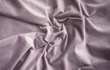 Pembe kadife pliseli, buruşuk yatak tekstili, lüks ipek kumaş arka plan ve kopyalama alanı.