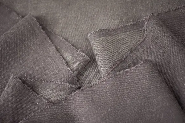 背景的灰色棉织物 服装生产用织物 — 图库照片