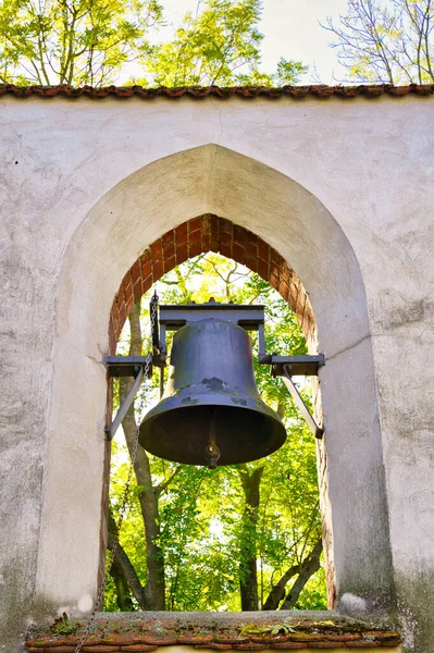 A small bell tower with a bell of a country church in Brandenburg, Germany