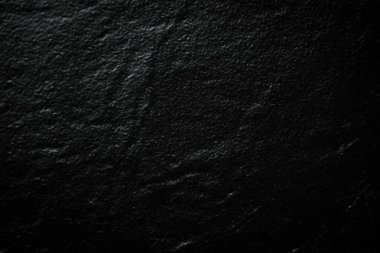 Siyah taş doku yüzeyi. Taş zemin. Üst görünüm.