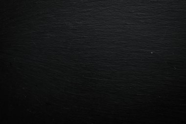 Siyah taş doku yüzeyi. Taş zemin. Üst görünüm.