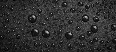 Siyah arka planda gliserin damlaları. Üst görünüm.