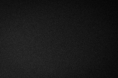 Siyah doku arka planı. Tasarım veya metin için desenli yüzey. Üst Manzara. Boş alan.