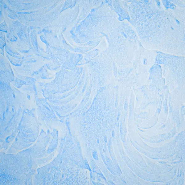 Tasarım için mavi duvar arka planı. Arka planlar için güzel desenli Venedik sıva kaplaması. Üst Manzara. Metin için boş alan.