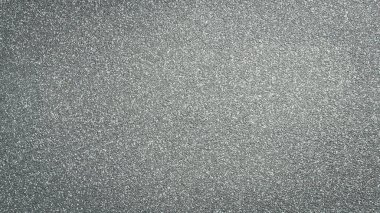 Gri kum arka planı. Desenli kum yüzeyi.