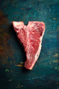 Kuru mermer yıllanmış T-Bone bifteği. Üst Manzara. Kapat..