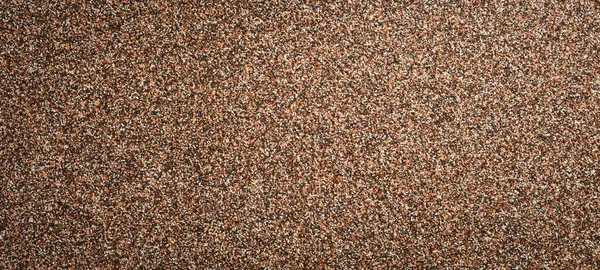 Kahverengi kum arka planı. Desenli kum yüzeyi.