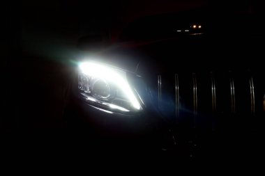 headlight led ray of the sports luxury Mercedes Benz c-class c200 coupe AMG dynamic model park in dark garage for checking maintance before delivered to customer clipart