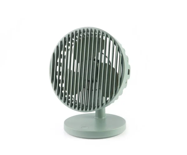 stock image usb chargeable fan is on the white table with background of white wall in the bedroom during summer