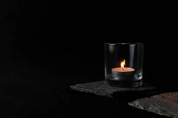 Aromatic Scented Tealight Candle Glass Black Table Many Stones Background — Stock Photo, Image