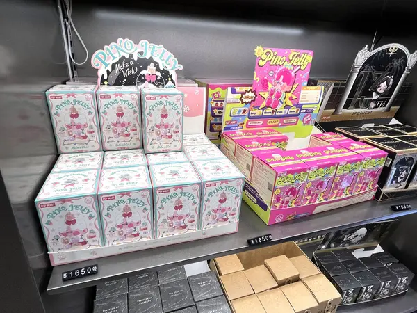 stock image famous mystery box or blind box of Pop Mart character of Pino Jelly and Skullpanda and many cute collections from China are display on shelf in Popmart store toy shop in Tokyo, Harajuku Japan