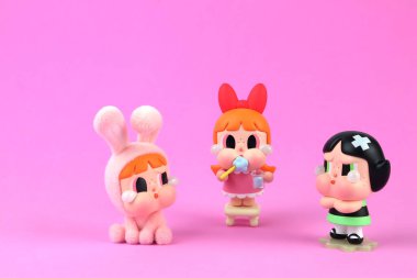 art toys crybaby collaboration with power puff girls collection from Pop Mart blind box collectable cute toys display on pink shelf with package of Popmart at Pop mart store during new release event clipart