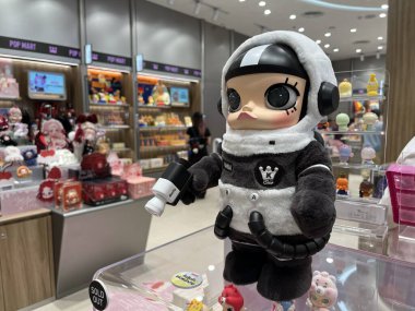 art toys mega space Molly collection from Pop Mart blind box collectable cute toys design of Hong Kong artist display on nice design shelf in Popmart store during new collection release molly plush