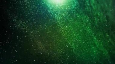 Irish Particles Floating Green Background 4K Loop features particles falling and swirling around in a deep green atmosphere in a loop.