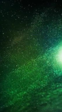 Dikey İrlanda Parçacıkları Yüzen Yeşil Arkaplan 4K Döngü parçacıkları derin yeşil bir atmosferde dikey oranda dönen ve akan parçacıklar içerir.