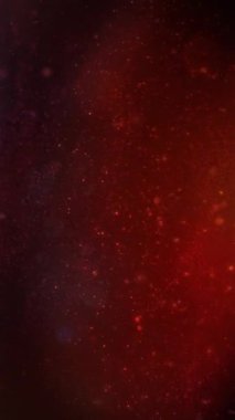 Dikey Parçacık ve Kar Yağmuru Kırmızı Atmosfer 4K Döngü kırmızı bir atmosferde kenardan çerçeve içinde akmakta olan farklı parçacıkları dikey oranda görüntüler..