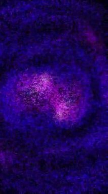 Vertical Purple Pink Particle Swirl 4K Loop features purple and pink particles swirling in circles in a vertical ratio loop.