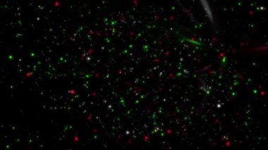 Yeşil ve Kırmızı Uzay Parçacığı 4K döngüsü, siyah bir zemin üzerinde ışıklar yanıp sönen kırmızı ve yeşil renkli göstericiden uzaklaşan simler veya parçacıklar içerir..