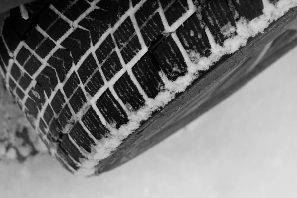 Closeup Photo Of Packed With Snow Contact Patch Of Non Studded Car Tire