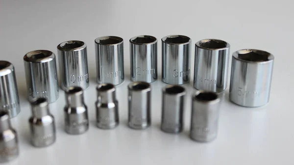 Glänzende Steckdosen Aus Stahl Für Schnellwechselratschenschlüssel Einer Reihe Auf Einer — Stockfoto