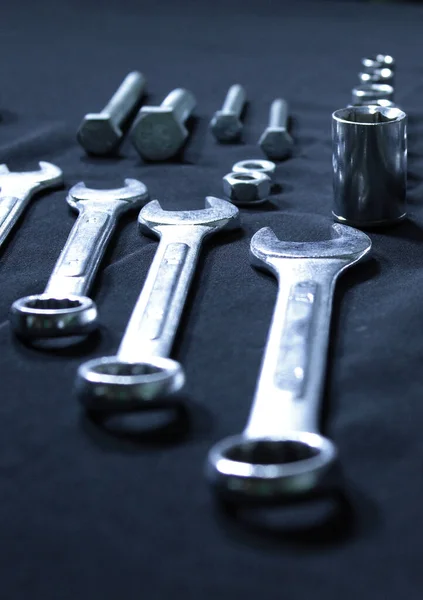 Metal Socket Wrench Bits, Screw Bolts And Steel Wrenches In A Size Comparison Vertical Stock Photo