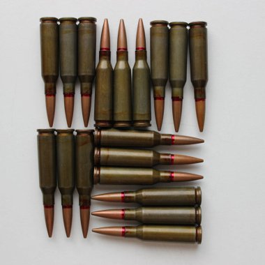 A square with smooth edges made of bullets on a white surface