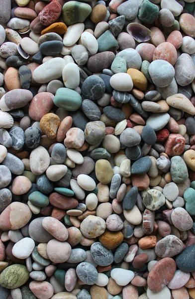Top view of smooth surface of colored pebble stones stock photo for backgrounds
