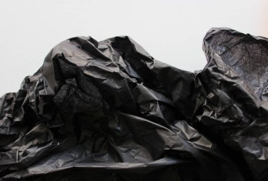 Pattern Of Black Crumpled Packaging Material Vertical Stock Photo  clipart