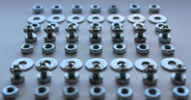 Variety Fixing Hardware Laid Out In Straight Lines Angle View Closeup Stock Image clipart