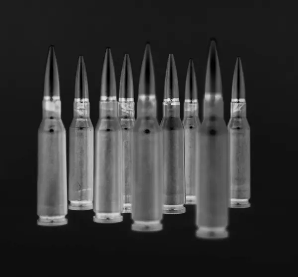 stock image Group of bullets stay on a black background in radiograph style creative stock image