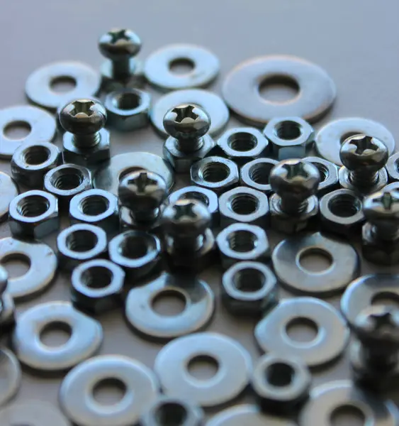 stock image Screw Bolts, Threaded Bolts And Flat Washers Fitted Each Other On White Surface Macro Shot Stock Image