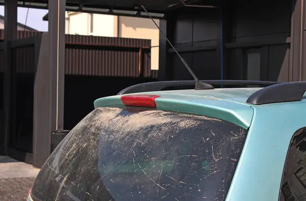 stock image Dirty Rear Glass Of Vehicle In Front Of Depot Of Car Wash Station