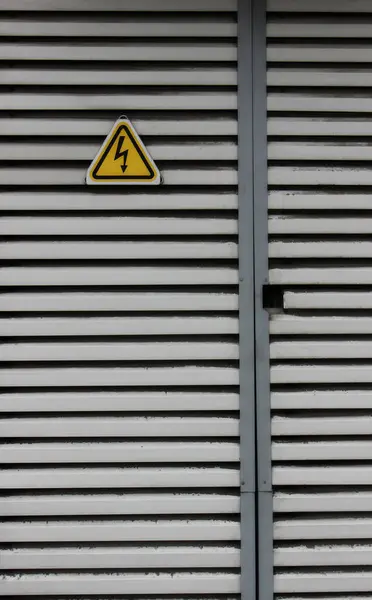 stock image High Voltage Transformer Door With High Voltage Risk Sign. Vertical Image For Power And Energy Backgrounds