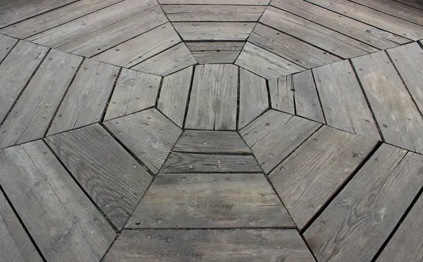 stock image Technology of laying wooden floors in a round room. Old floorboards of a round room