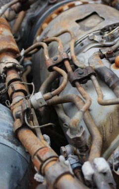 Steampunk Style Details of Old Engine with Rusty Parts. Corrosion on the engine parts, pipes and fuel lines clipart