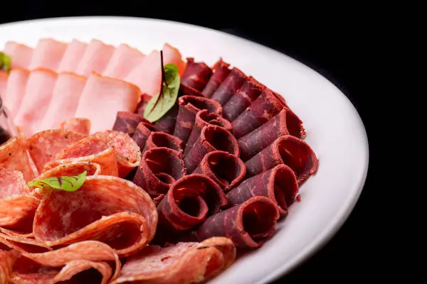 sliced prosciutto on a plate