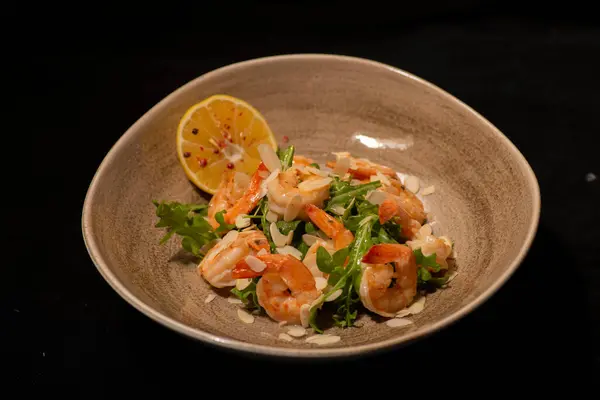seafood salad with shrimps, lemon and basil.