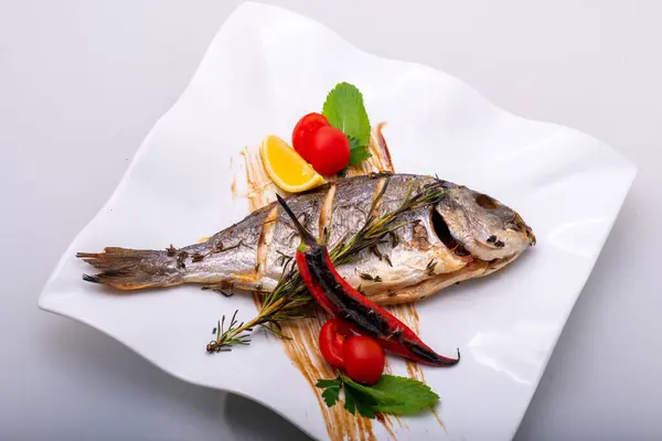 baked fish with vegetables and herbs