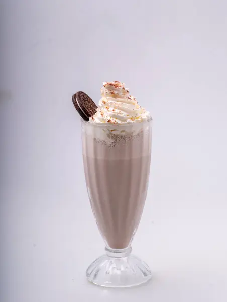 chocolate milkshake with whipped cream and chocolate.
