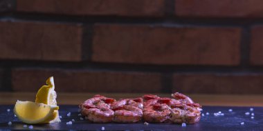 fresh red meat with salt and pepper.