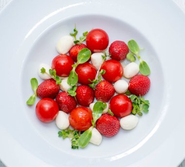 fresh and ripe strawberries on a white table, healthy food