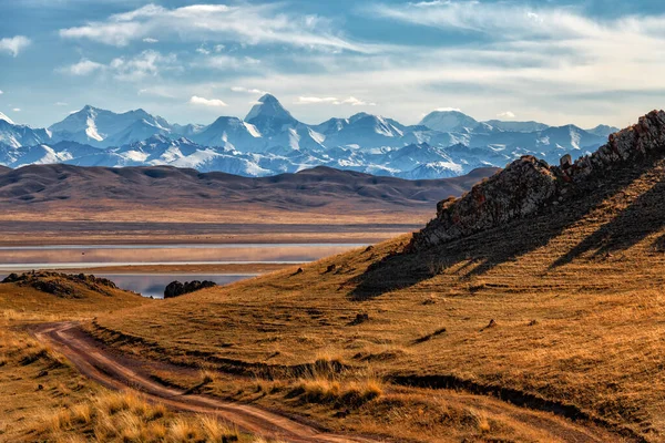 stock image Northern Tien Shan mountain range with Khan Tengri peak in southeast Kazakhstan under a cloudy sky