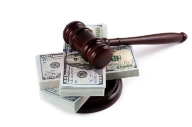 Judge's gavel and 100 american dollar banknotes on white background