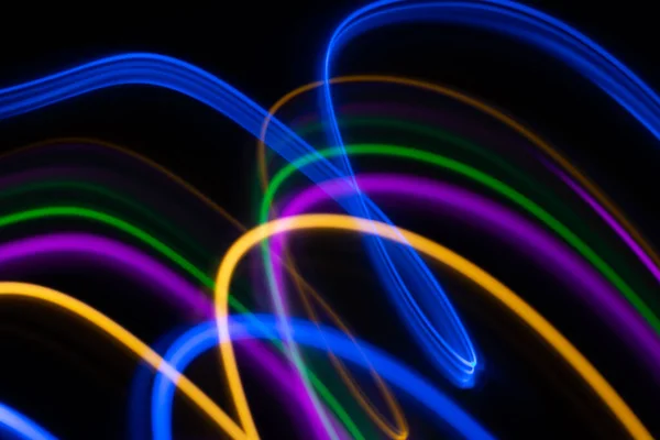 Multicolored light lines on a black background