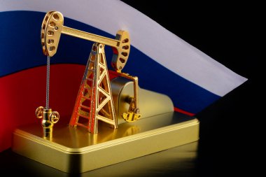 Gold model of an oil pump and the flag of the Russian Federation